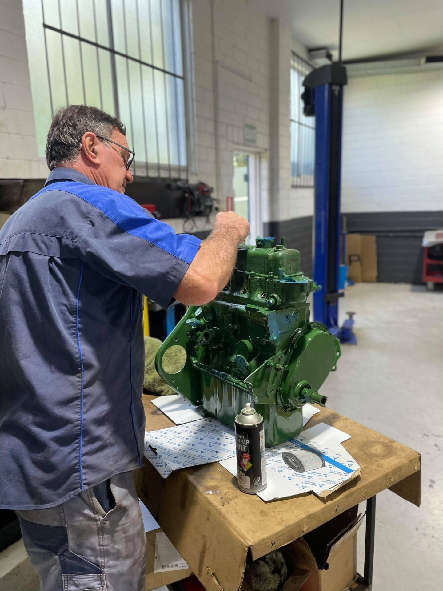 Rebuilt and repainted classic engine on the workshop bench