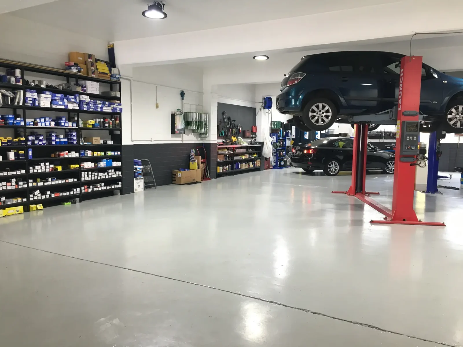 Fully stocked parts shelving and hoist bay at the Hornsby workshop